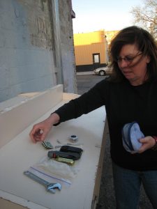 Susan placing tools on a table