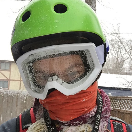 Selfie of winter rider after the ride with lots of percipitation on their face