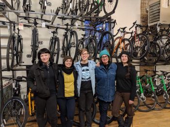 Group of five FTWs at a bike shop