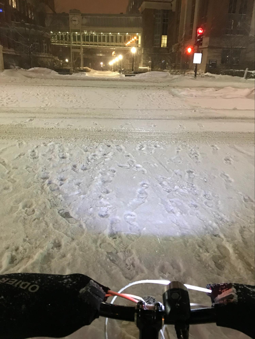 view of a winter scene from the point of view of a bike rider